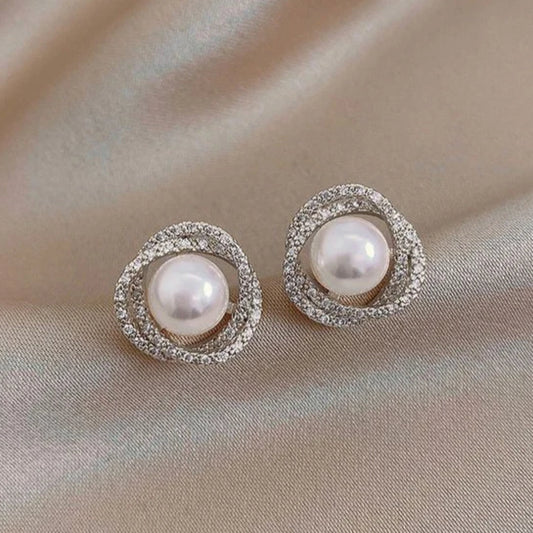 Boucles d'oreilles spirales argentées avec perles