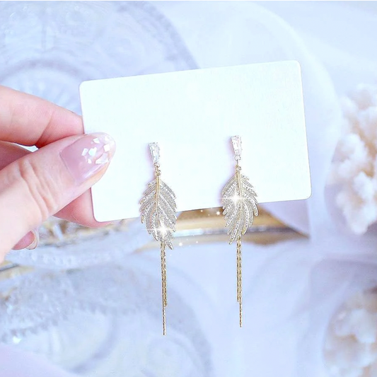 Boucles d'oreilles en Plume d'or Scintillante