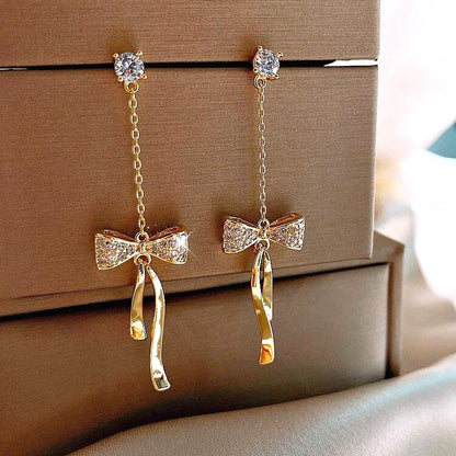 Boucles d'Oreilles avec Nœud en Cristal